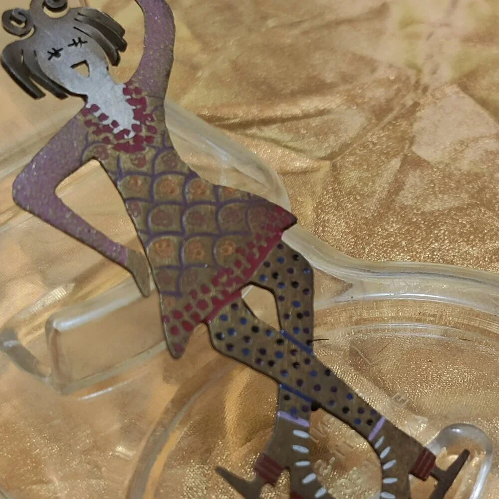 Brooch of a whimsical girl Figure Skater. Signed GB.